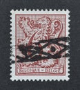 Cancelled postage stamp printed by Belgium, that shows Number on Heraldic Lion and pennant Royalty Free Stock Photo