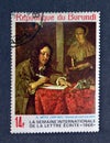 Cancelled postage stamp printed by Burundi, that shows Painting Man Writing a Letter by Gabriel Metsu