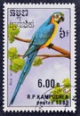 Cancelled postage stamp printed by Cambodia, that shows Blue-and-yellow Macaw