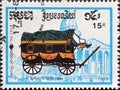 Cancelled postage stamp printed by Cambodia, that shows Royal Post coach