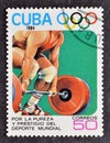 Cancelled postage stamp printed by Cuba, that shows Weight lifting