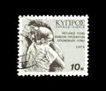 Cancelled postage stamp printed by cypress, that shows refugees