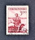 Cancelled postage stamp printed by Czechoslovakia, that shows Woman Tractor Operator