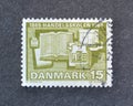 Cancelled postage stamp printed by Denmark, that shows First school of commerce