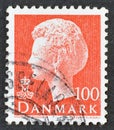 Cancelled postage stamp printed by Denmark, that shows portrait of queen Margrethe