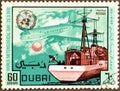 Cancelled postage stamp printed by Dubai, that shows Ocean Weather Ship Launching Radio Sonde, and Hastings Plane, World Day of Me