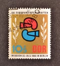 Cancelled postage stamp printed by East Germany, that shows Boxing gloves