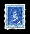 Cancelled postage stamp printed by East Germany, that shows portrait of Carl Maria von Weber