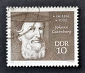 Cancelled postage stamp printed by East Germany, that shows portrait of Johann Gutenberg