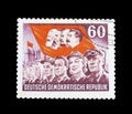 Postage stamp printed by East Germany, that shows workers and red flag with portraits of Marx, Engels, Stalin and Lenin Royalty Free Stock Photo