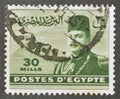 Cancelled postage stamp printed by Egypt, that shows King Farouk in front of Pyramids of Giza Royalty Free Stock Photo