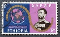 Cancelled postage stamp printed by Ethiopia, that shows World map and Haile Selassie