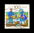 Cancelled postage stamp printed by Germany, that shows Mailman delivering mail Royalty Free Stock Photo