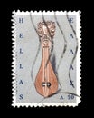 Cancelled postage stamp printed by Greece, that shows Cretan lyre