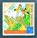 Cancelled postage stamp printed by Guinea Equatorial, that shows Football players, World cup trophy and Berlin