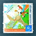 Cancelled postage stamp printed by Guinea Equatorial, that shows Football players, World cup trophy and Frankfurt