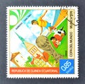 Cancelled postage stamp printed by Guinea Equatorial, that shows Football players, World cup trophy and Hannover