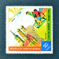 Cancelled postage stamp printed by Guinea Equatorial, that shows Football players, World cup trophy and Munich