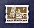 Cancelled postage stamp printed by Hungary, that shows Hydraulic lift truck and mail carriage