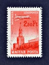 Cancelled postage stamp printed by Hungary, that shows Ilyushin II-18 Plane over Moscow