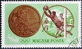 Cancelled postage stamp printed by Hungary, that shows Medal and Football