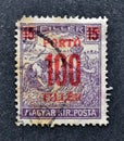 Cancelled postage stamp printed by Hungary, that shows Wheat harvest Overprinted