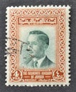 Cancelled postage stamp printed by Jordan, that shows King Hussein II