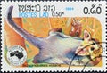 Cancelled postage stamp printed by Laos, that shows Greater Glider Schoinobates volans Royalty Free Stock Photo