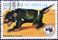 Cancelled postage stamp printed by Laos, that shows Tasmanian Devil