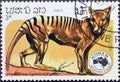 Cancelled postage stamp printed by Laos, that shows Tasmanian Tiger Thylacinus cynocephalus Royalty Free Stock Photo