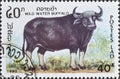 Cancelled postage stamp printed by Laos, that shows Wild Water Buffalo