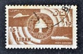 Cancelled postage stamp printed by Lebanon, that shows Symbols of communications and cedar tree