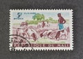 Cancelled postage stamp printed by Mali, that shows Shepherd, Sheep Ovis ammon aries, Cattle