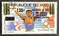 Cancelled postage stamp printed by Mali, that shows Weight lifting