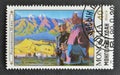 Cancelled postage stamp printed by Mongolia, that shows Painting Two men, mountains