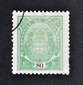 Cancelled postage stamp printed by Mozambique, that shows Company Coat of Arms Royalty Free Stock Photo