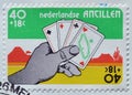 Cancelled postage stamp printed Netherlands Antilles, that shows Hand Holding Cards