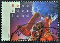 Cancelled postage stamp printed by Netherlands, that shows Big Bird Pino, Tommie and Ieniemienie Royalty Free Stock Photo