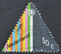 Cancelled postage stamp printed by Netherlands, that shows Candle