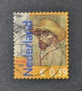 Cancelled postage stamp printed by Netherlands, that shows Self-portrait with straw hat Royalty Free Stock Photo