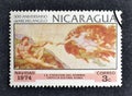 Cancelled postage stamp printed by Nicaragua, that shows The Creation of Adam, Sistine chapel Royalty Free Stock Photo