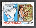 Cancelled postage stamp printed by Nicaragua, that shows Map and Coffee Picker