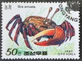 Cancelled postage stamp printed by North Korea, that shows Bowed Fiddler Crab