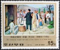 Cancelled postage stamp printed by North Korea, that shows Leader Giving house to farm-hand