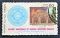 Cancelled postage stamp printed by Pakistan, that shows Conference Crest and Burning of Alaqsa Mosque