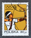 Cancelled postage stamp printed by Poland, that shows Archery Royalty Free Stock Photo