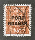 Cancelled postage stamp printed by Poland, that shows Coat of arms, overprinted