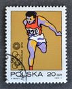 Cancelled postage stamp printed by Poland, that shows Running Royalty Free Stock Photo