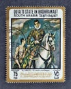 Cancelled postage stamp printed by Qu`aiti State in Hadhramaut, South Arabia, that shows St,Martin and Beggar by El Greco