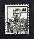 cancelled postage stamp printed by Romania, that shows Bricklayer Royalty Free Stock Photo